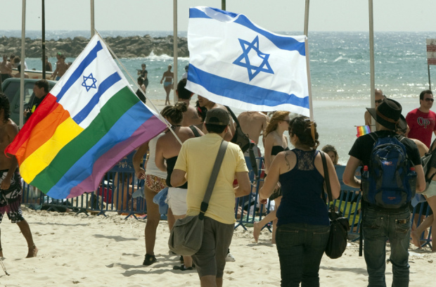Israelis wave their national flag along